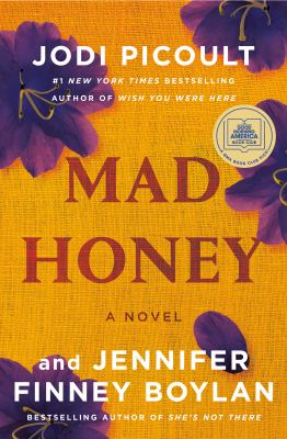 Image is the cover of the book "Mad Honey" by Jodi Picoult and Jennifer Finney Boylan. It is a golden yellow with violet flowers. The title text is red, and the author text is white.