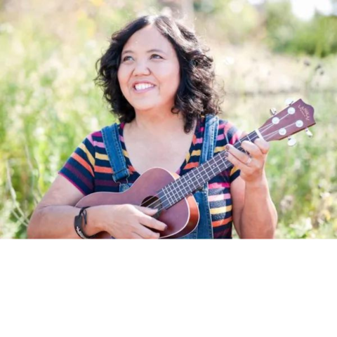 photo of Little Miss Ann holding a ukulele