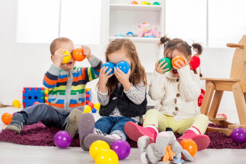 Children playing with colorful toy balls