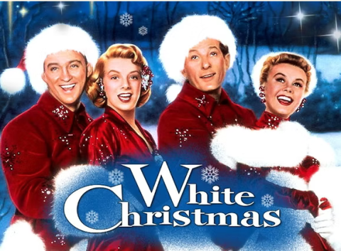 Advertising image from the movie White Christmas featuring two men in Santa suits and two women dressed as Mrs. Claus. They are in front of a blue background with falling snow, with the words White Christmas written below in white capital letters with a blue glow around them.
