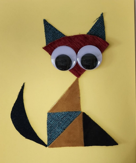 cat made out of colorful shapes with large googly eyes