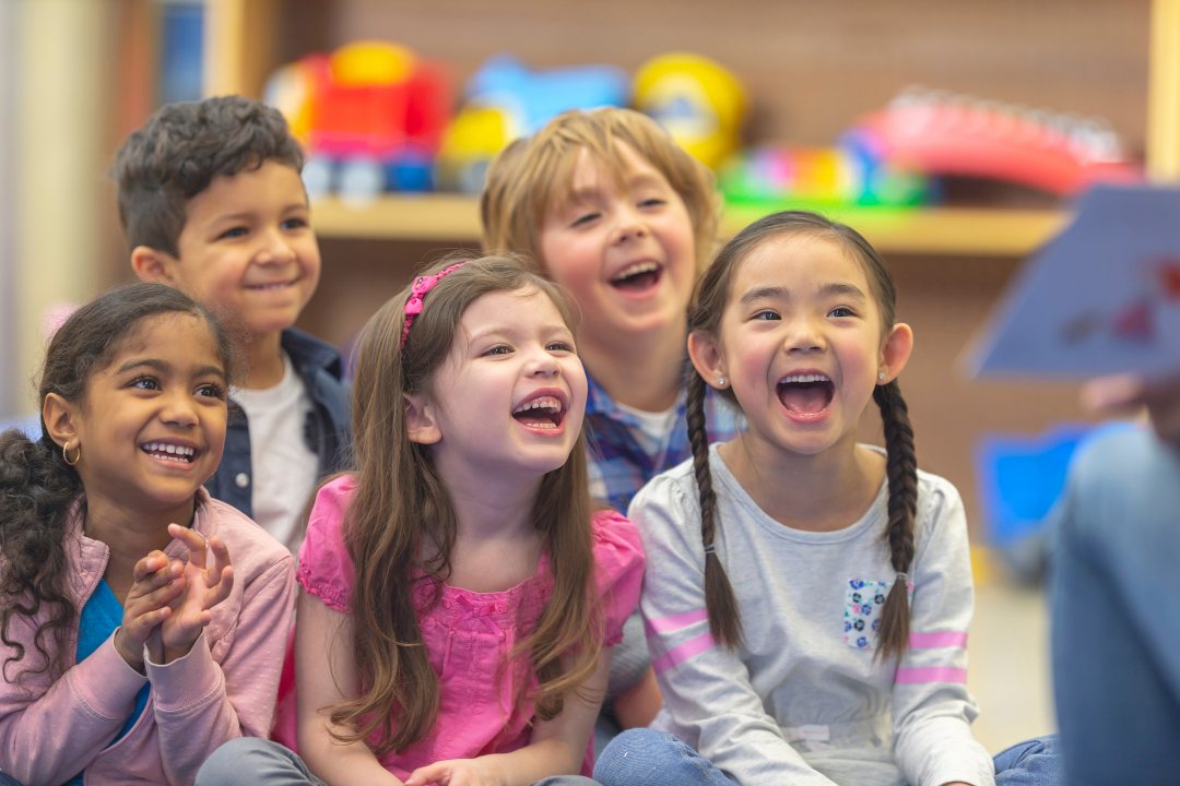 Children laughing during a storytime book