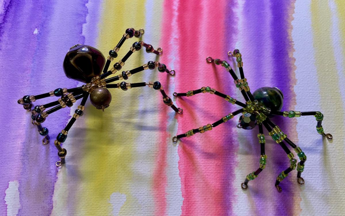 Spiders made from crystal and ceramic beads.