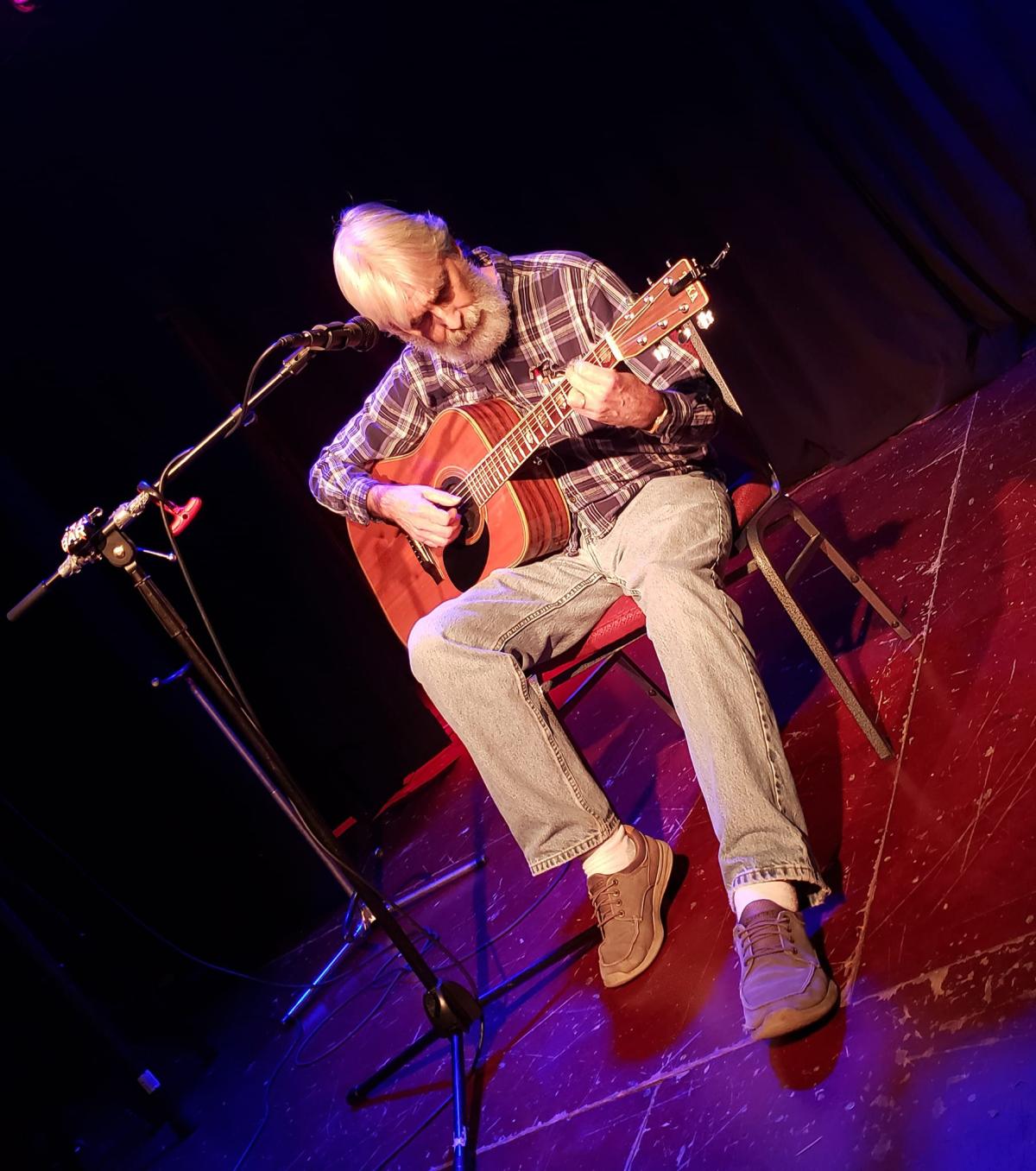 Neil Potter playing the guitar.